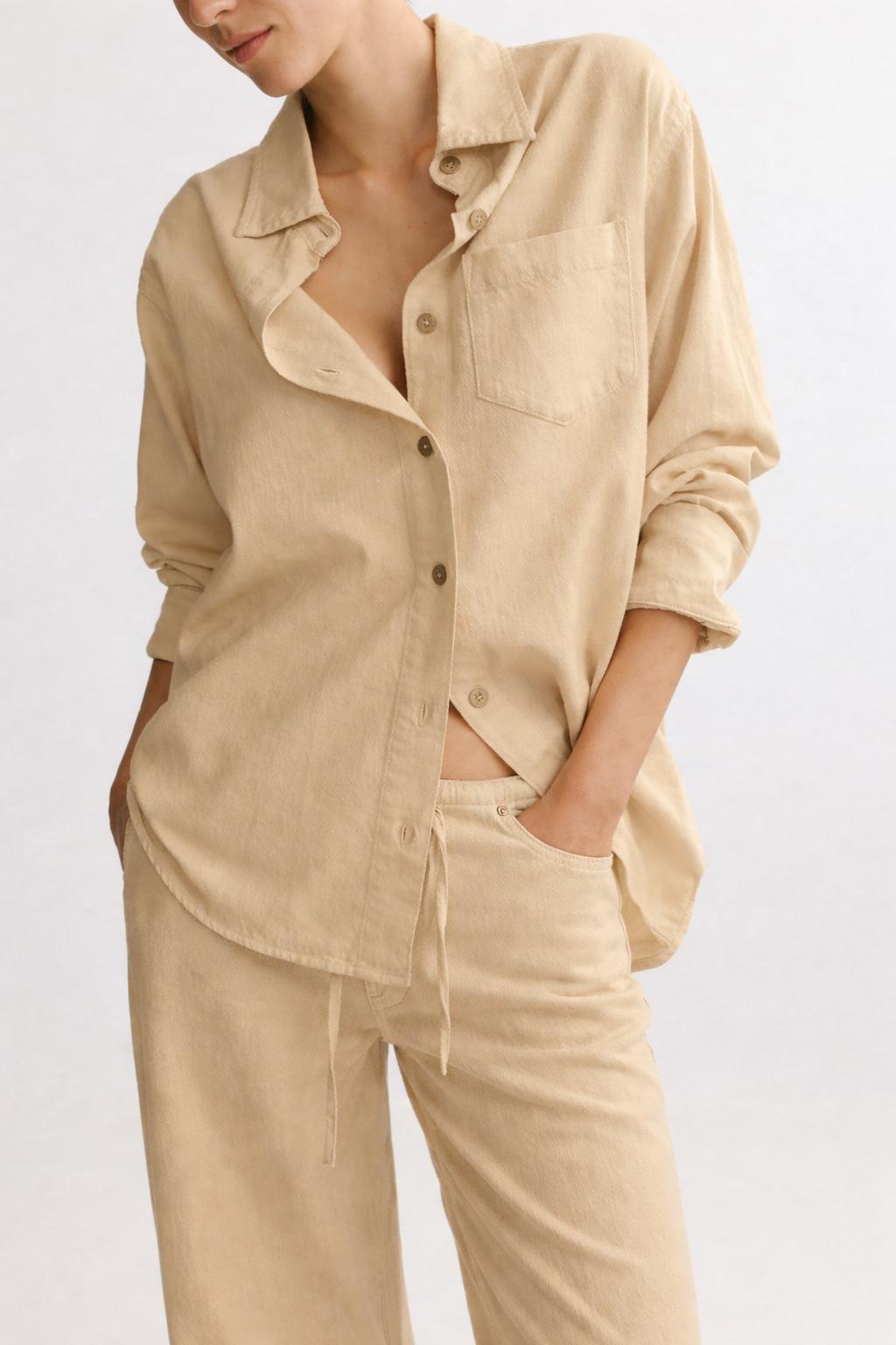 Cream long-sleeve button-front shirt with matching drawstring pants